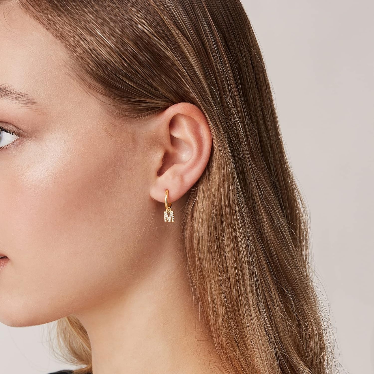 image:imagePAVOI 14K Gold Plated 925 Sterling Silver Post Huggie Earring with Initial Dangle CZ Huggie Hoop Earrings Womens Cubic Zirconia Initial HuggiesYellow Gold