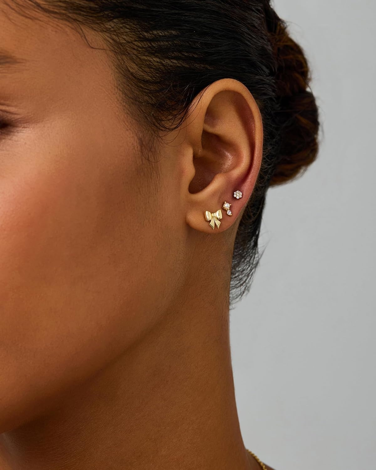 image:imagePAVOI 14K Gold Plated Dainty Flat Back Earrings for Women Hypoallergenic Sterling Silver Posts Helix Cartilage Piercing Jewelry Emoji Motif Bow Celestial Flatback Gold Stud Earrings Screw BackBow Pearl Trio Set