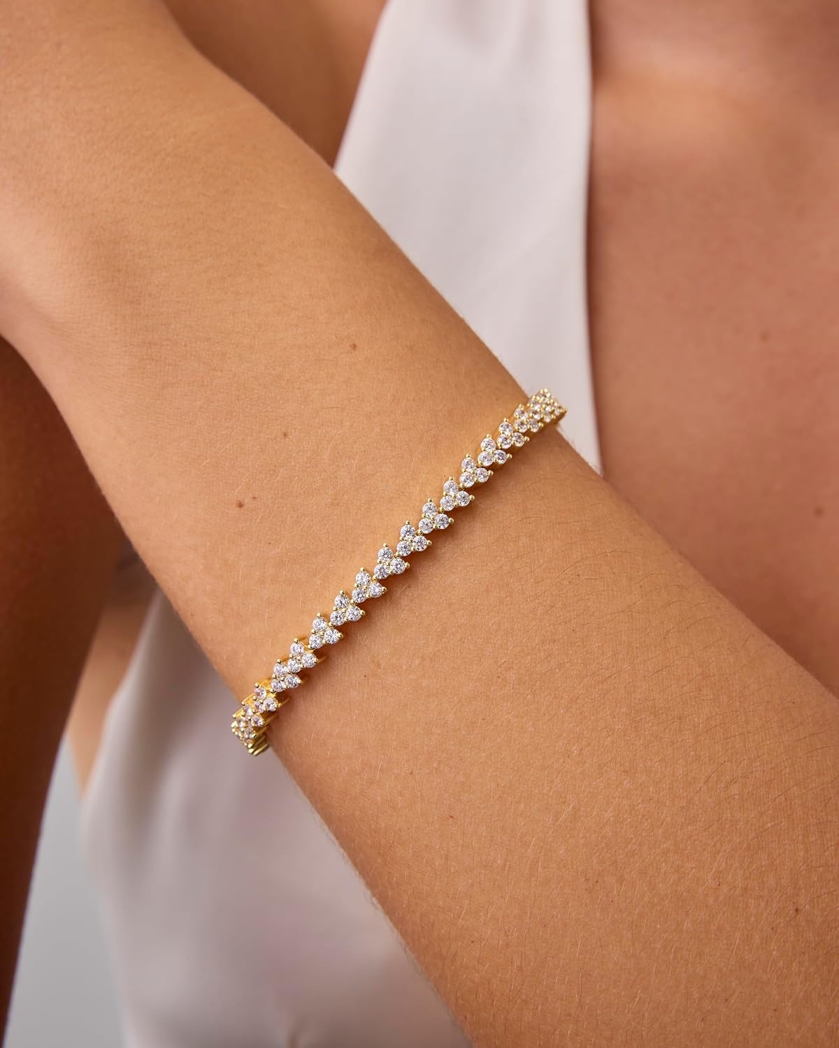 image:imagePAVOI 14K Gold Plated Tennis Bracelets for Women Bezel Set Cubic Zirconia Bracelet Simulated Diamonds Round Trillion Trinity Radiant Pear Valentines Day Heart Cut Stones Wedding Jewelry Gifts for BridesWhite Gold