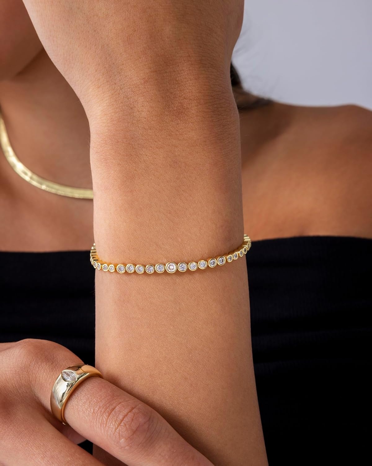 image:imagePAVOI 14K Gold Plated Tennis Bracelets for Women Bezel Set Cubic Zirconia Bracelet Simulated Diamonds Round Trillion Trinity Radiant Pear Valentines Day Heart Cut Stones Wedding Jewelry Gifts for BridesYellow Gold