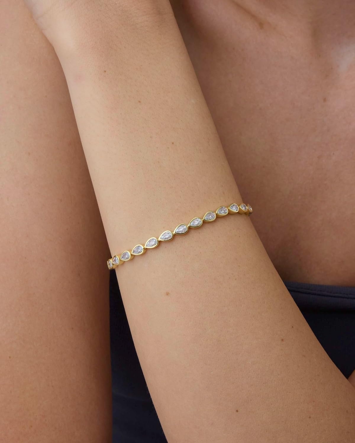 image:imagePAVOI 14K Gold Plated Tennis Bracelets for Women Bezel Set Cubic Zirconia Bracelet Simulated Diamonds Round Trillion Trinity Radiant Pear Valentines Day Heart Cut Stones Wedding Jewelry Gifts for BridesYellow Gold